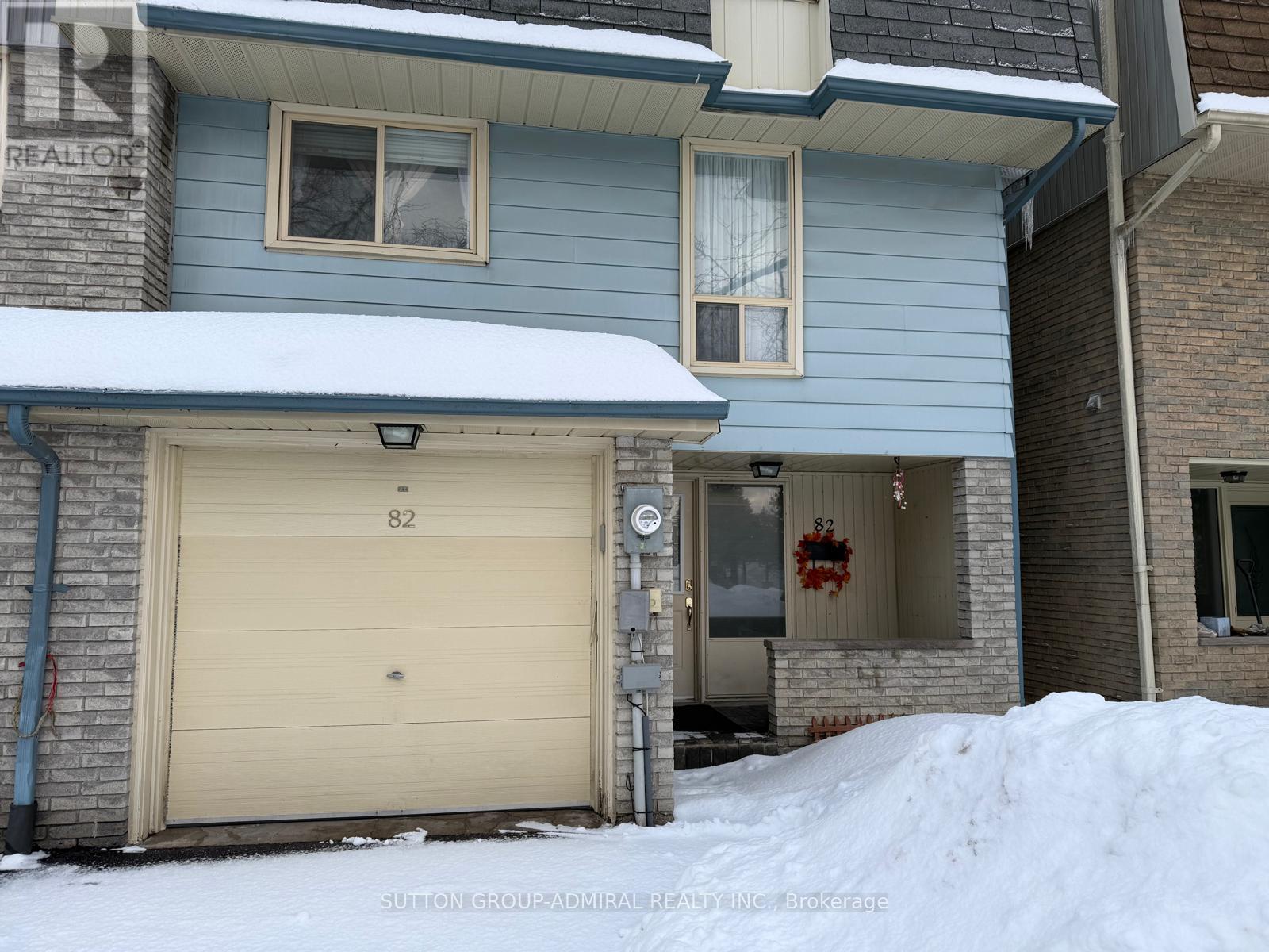 A house with a garage door number 82.