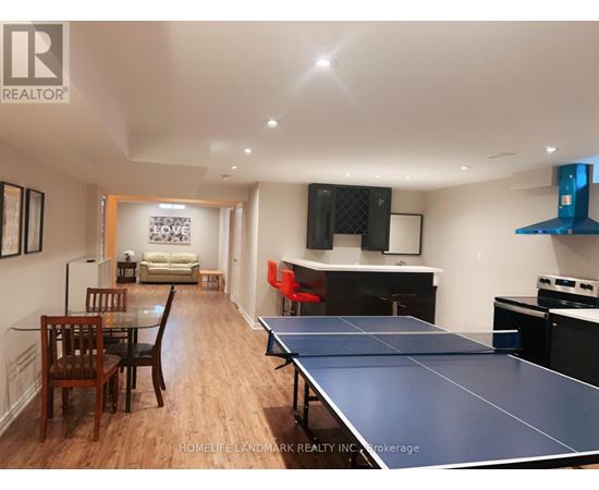 A ping pong table is in the middle of a living room.