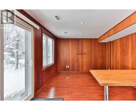 A room with wooden walls and a table.