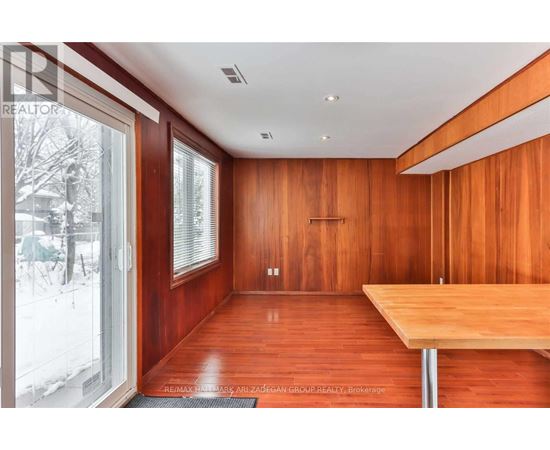 A room with wooden walls and a table.