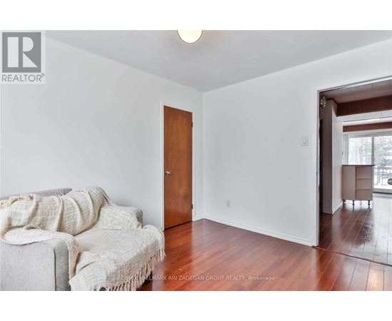 A living room with a couch and a door.