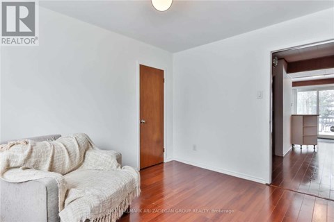 A living room with a couch and a door.