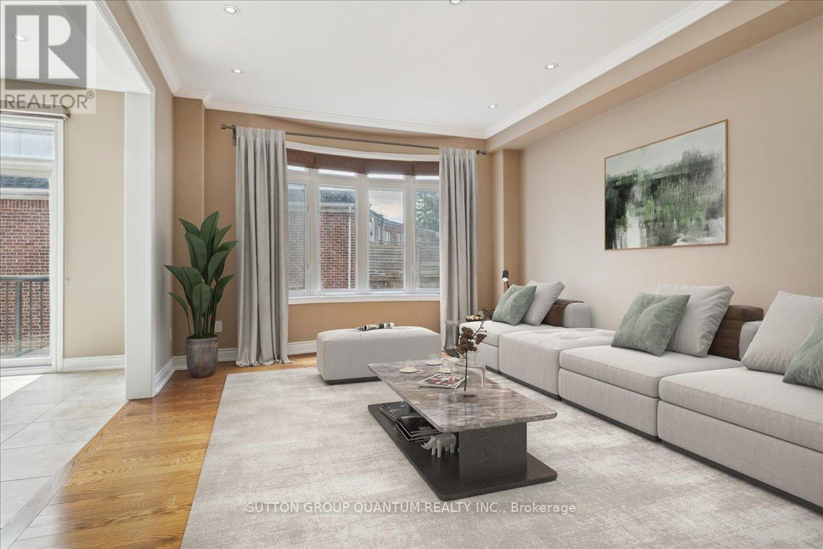 A living room with a large couch, a coffee table, and a painting on the wall.