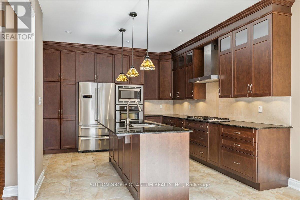 A modern kitchen with wooden cabinets and stainless steel appliances.
