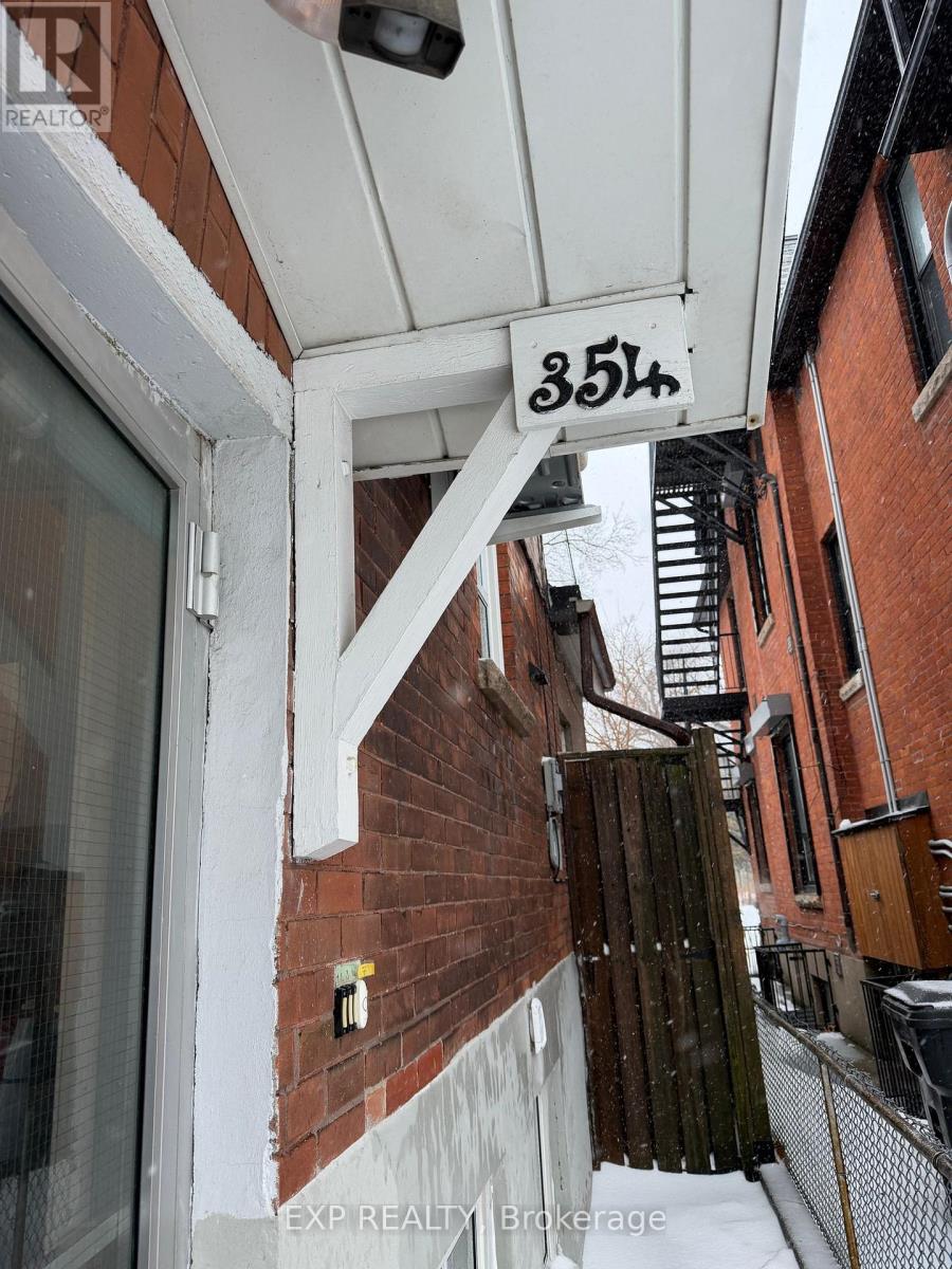 A building with the number 354 on the sign above the door.