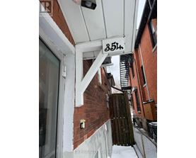 A building with the number 354 on the sign above the door.