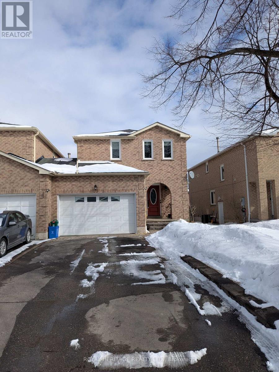 A house with a garage and a car parked in front.