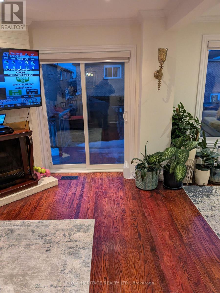 A living room with a TV screen showing a game.