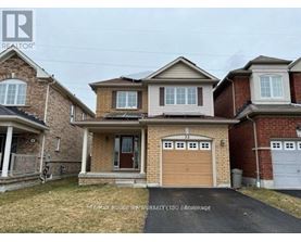 A house with a brown garage door is for sale.