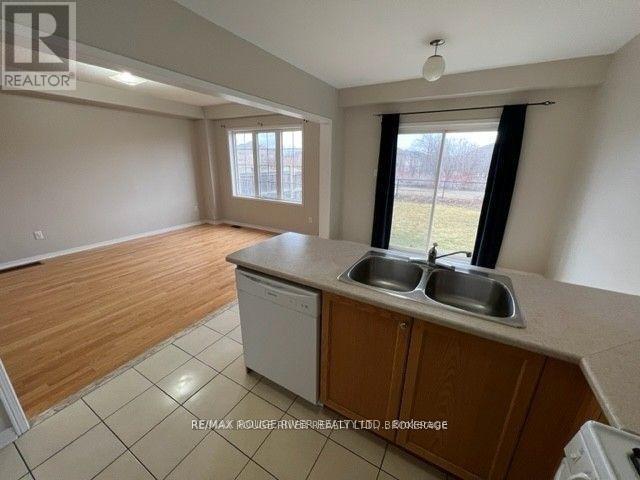 A kitchen with a dishwasher and a sink.