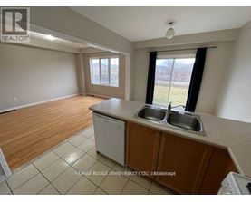 A kitchen with a dishwasher and a sink.