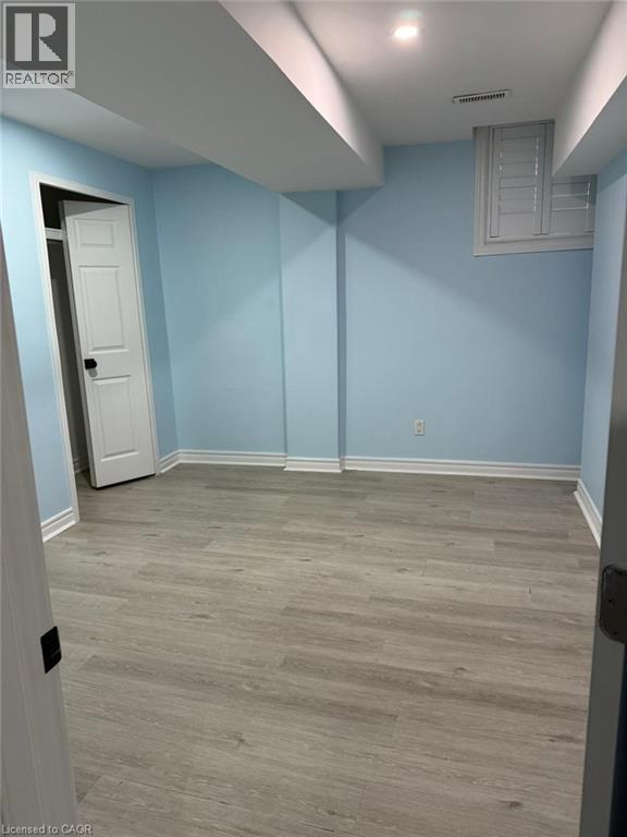 A room with light blue walls and a white door.