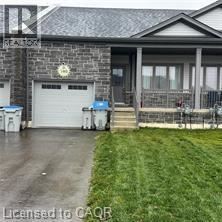 A house with a garage and a driveway.