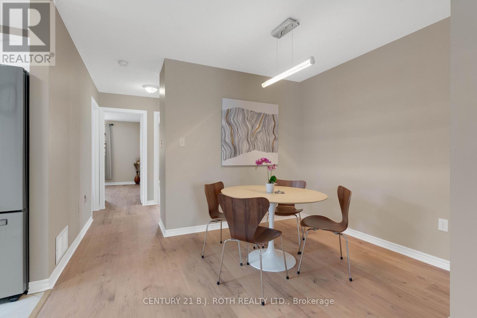A dining room with a table set for two.