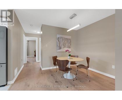 A dining room with a table set for two.