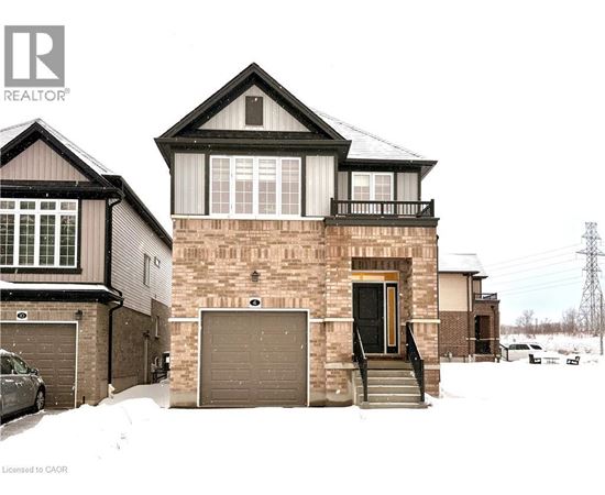 A house with a brown garage door is in front of a house with a black garage door.