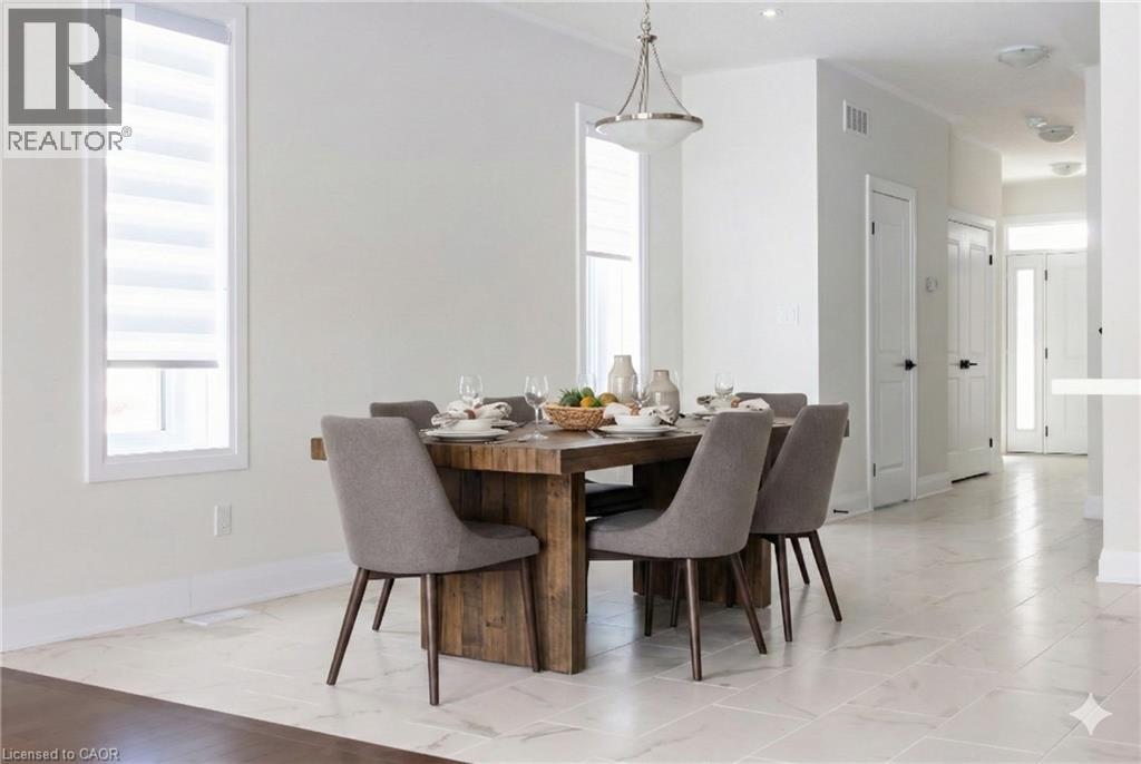A dining room with a table set for four.