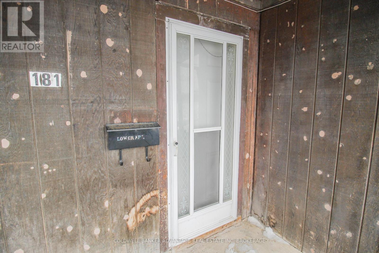 A door with a glass panel and a sign that says "LOWER A".