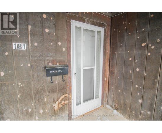 A door with a glass panel and a sign that says "LOWER A".