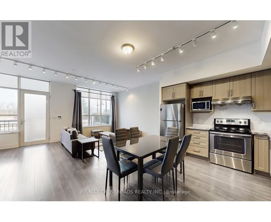 A modern kitchen with a dining table and chairs.