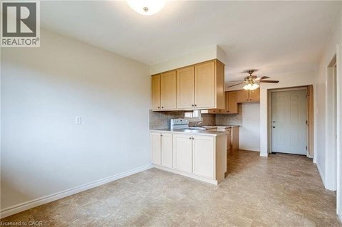 A kitchen area with a counter and cabinets.