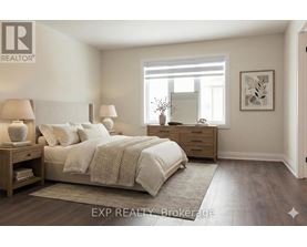 A bedroom with a bed, nightstands, and a window.