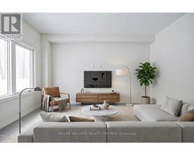 A living room with a grey couch, a wooden coffee table, a flat screen TV, a potted plant, and a window with white curtains.
