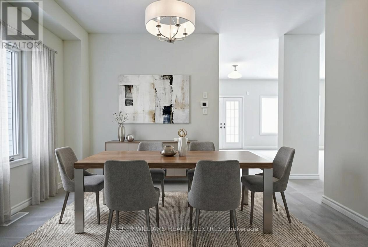 A dining room with a table set for four.