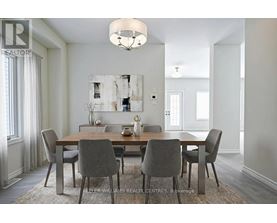 A dining room with a table set for four.