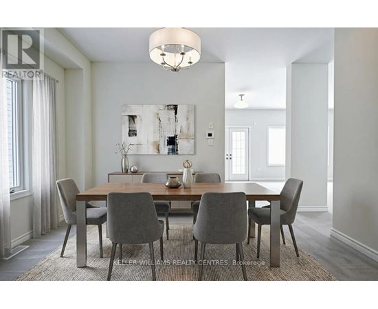 A dining room with a table set for four.