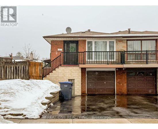 A house with a snow bank in front of it.