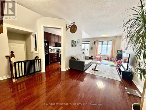 A living room with a couch and a television.