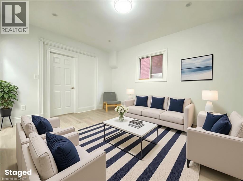 A living room with a white couch and a coffee table.