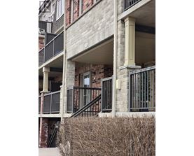 A building with a balcony and a staircase.