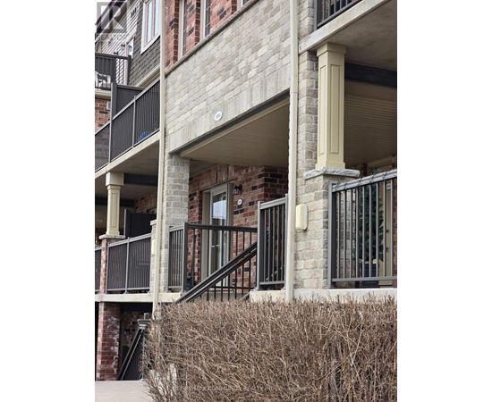 A building with a balcony and a staircase.