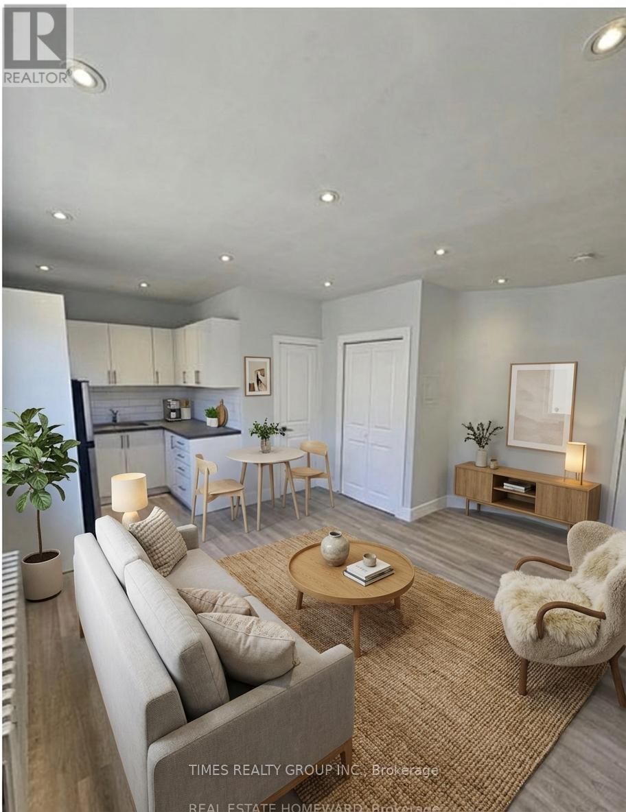 A well-lit living room with a grey sofa and wooden coffee table.