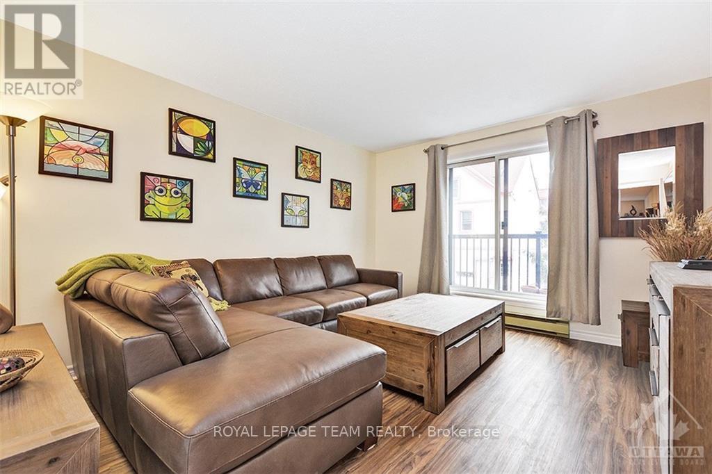 A living room with a brown leather couch and a coffee table.