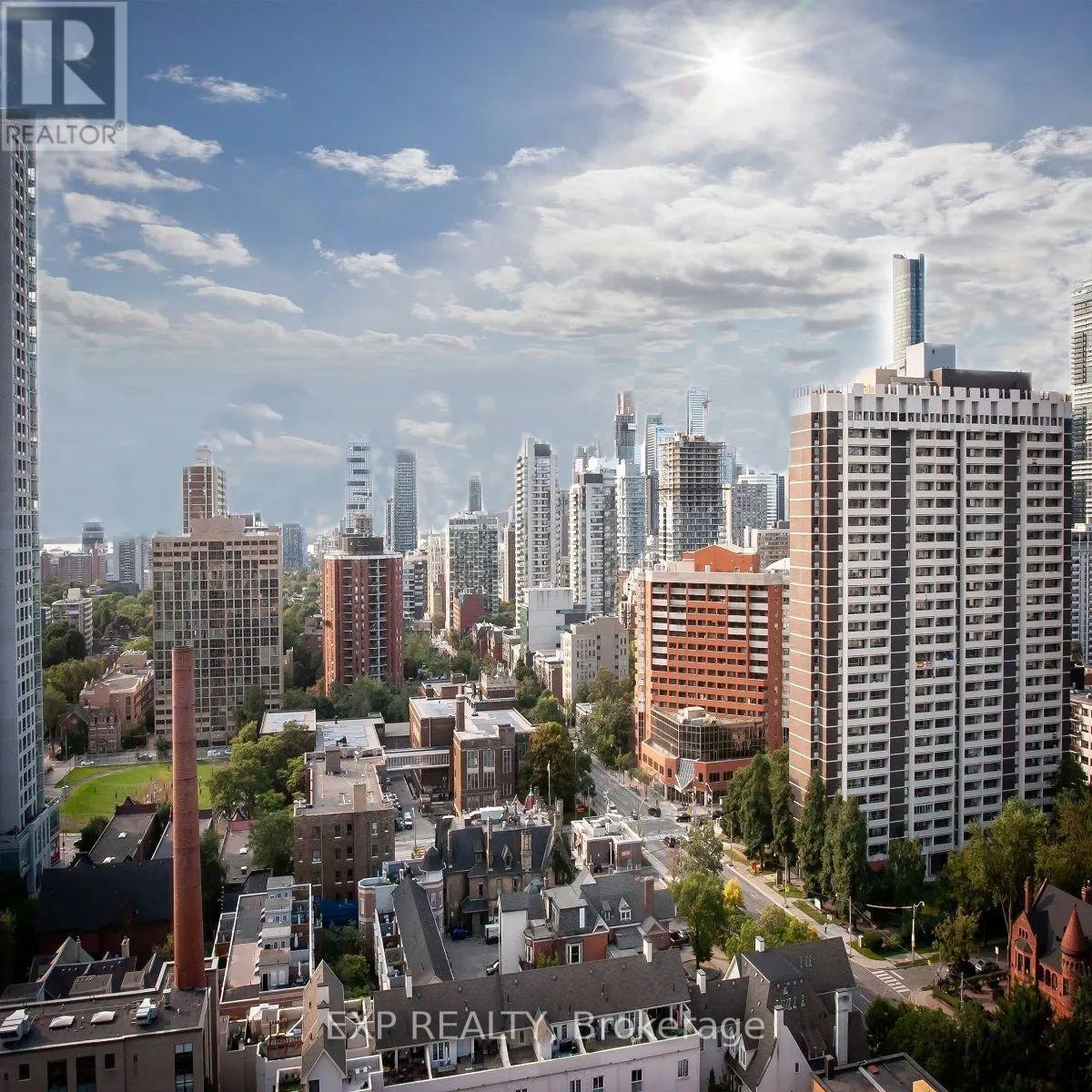 A cityscape with tall buildings and a clear sky.