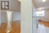 A room with wooden floors and white walls.