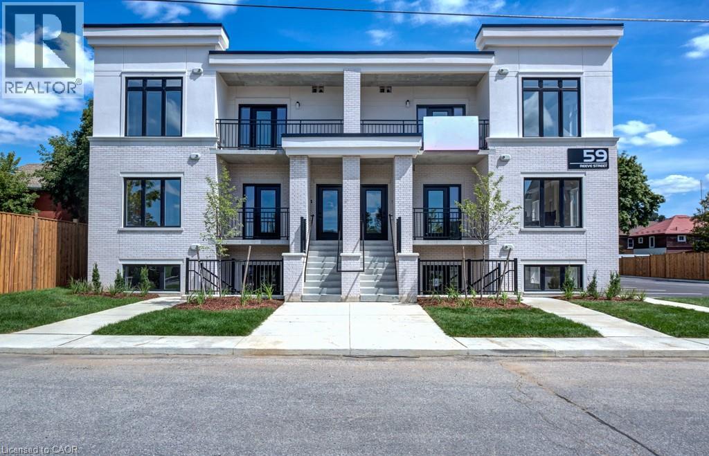 A modern two-story building with a balcony on the second floor.