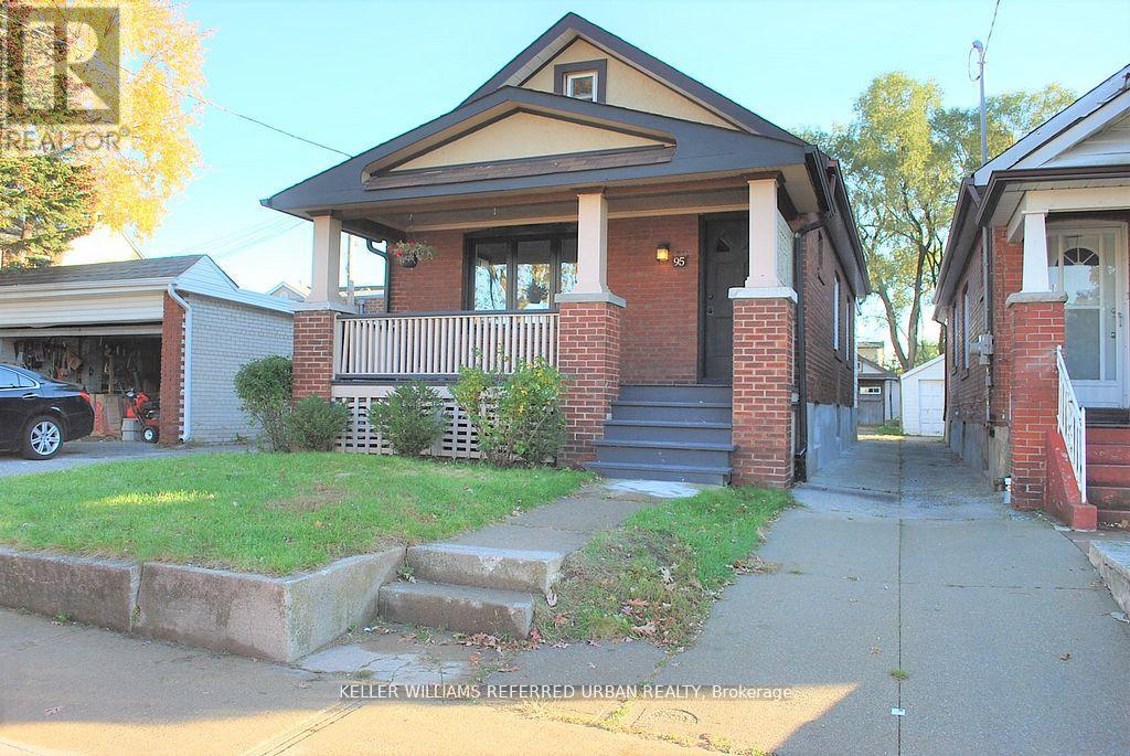 A house with a brick pillar and a porch is shown.
