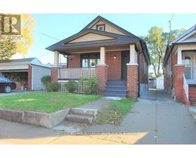 A house with a brick pillar and a porch is shown.