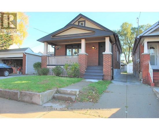 A house with a brick pillar and a porch is shown.
