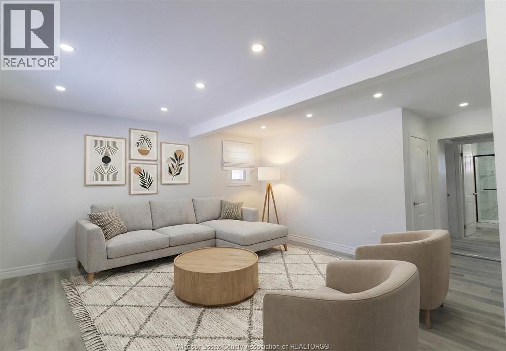 A living room with a grey couch, a coffee table, and a rug.
