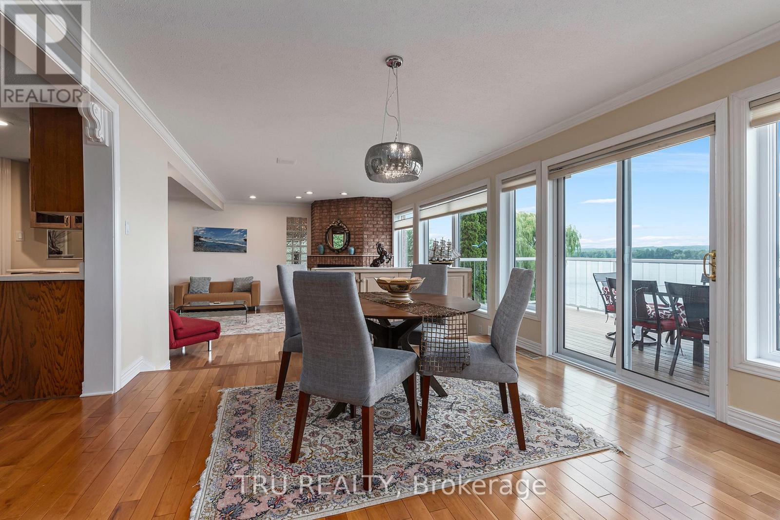A dining room with a table set for six.
