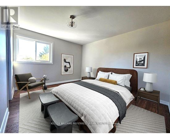 A bedroom with a large bed and a chair by the window.