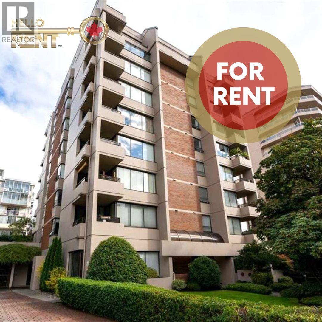 A building with a sign that says "FOR RENT" in front of it.