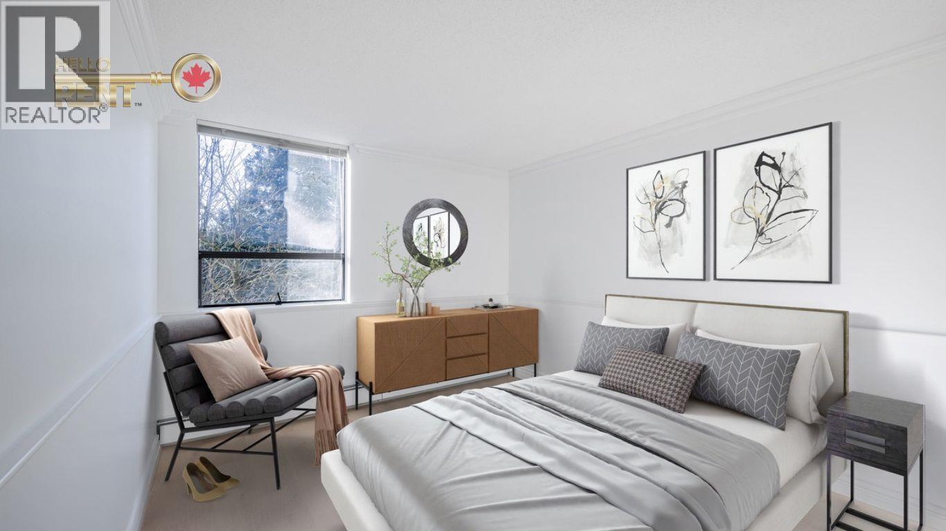 A bedroom with a large bed, a chair, and a window.