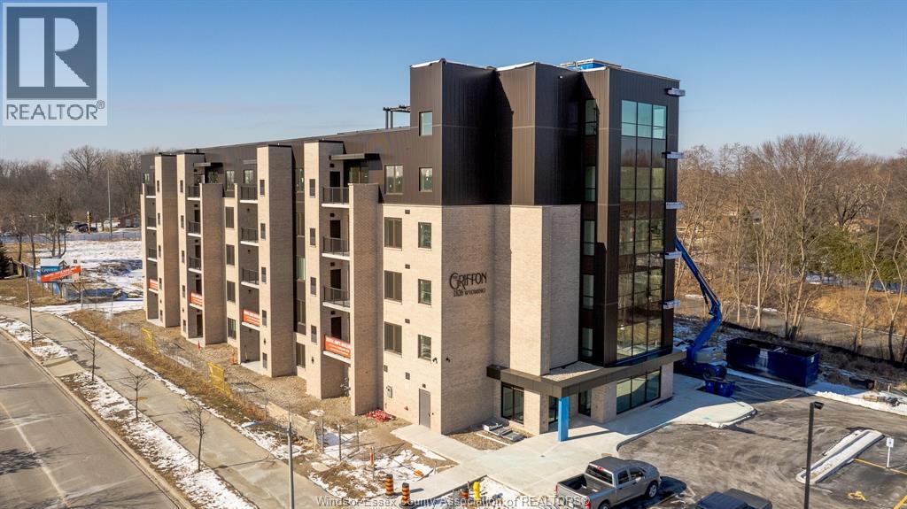 A modern building with a crane in front of it.