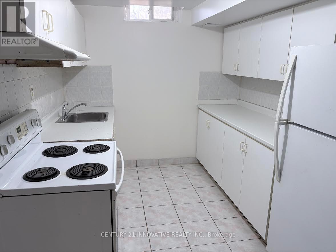 A bathroom with a marble tile shower and a white toilet.